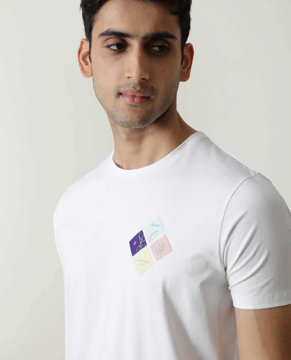 Rare Rabbit Men's Badget White Cotton Lycra Fabric Crew Neck Half Sleeves Regular Fit Graphic Print Branding T-Shirt