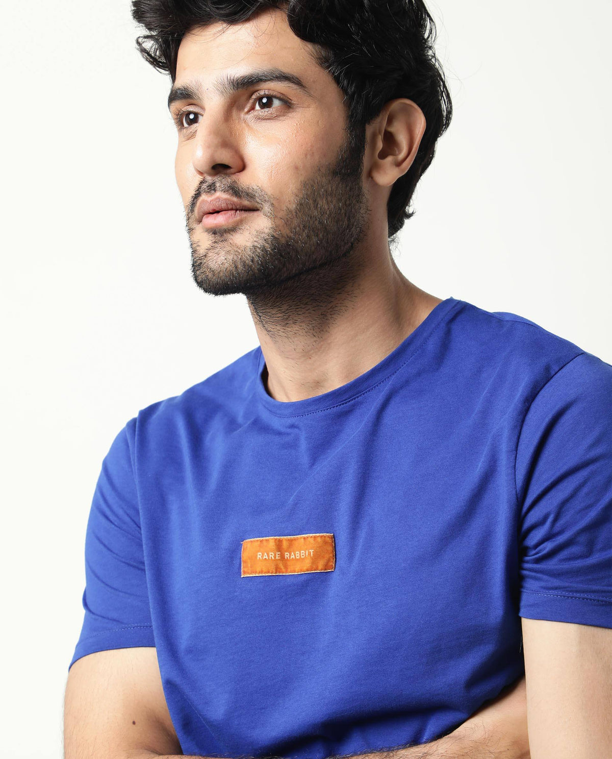 Rare Rabbit Men's Trix Fluorescent Blue Cotton Fabric Crew Neck Half Sleeves Slim Fit Velvet Badge Solid T-Shirt